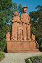 Sculpture of immigrant family in a garden