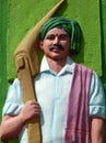 Sculpture of Indian agricultural labor man,in traditional dress, with the plough