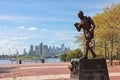 The sculpture of Jersey Joe Walcott, a famous professional boxer at Camden waterfront with Philadelphia skyline in the background