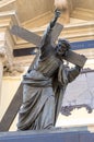 Sculpture of Jesus Christ with a cross on the facade of the house. Warsaw, Poland - August 27, 2019