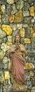 Sculpture of Jesus at the red stone background Royalty Free Stock Photo