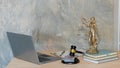 Sculpture justice bronze lady and book and hammer with laptop Blind justice symbol on concept metal sculpture. female judge Royalty Free Stock Photo