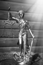 Sculpture of justice goddess on wood lining