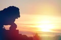 Sculpture of a lion on the Admiralty embankment on a sunset