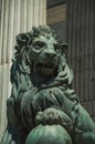 Sculpture lion cast in bronze on building facade in Madrid Royalty Free Stock Photo