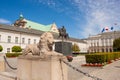 Sculpture of lion and equestrian statue of Prince Jozef Antoni Poniatowski in front of Presidential Palace, Warsaw, Poland. Royalty Free Stock Photo