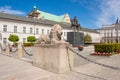 Sculpture of lion and equestrian statue of Prince Jozef Antoni Poniatowski in front of Presidential Palace, Warsaw, Poland. Royalty Free Stock Photo