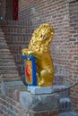 Sculpture : a lion holding shield with coat of arms Royalty Free Stock Photo