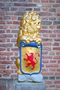 Sculpture : a lion holding shield with coat of arms Royalty Free Stock Photo