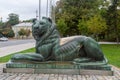 Sculpture of a lion, located near the Temple-monument of Alexander Nevsky. View of the streets of the city and the