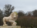 Sculpture of a lion of Medici with a ball in the paw in the park National Domain of Saint Cloud