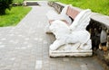 Sculpture of a lion`s head on a railing of a bench. Lion with wings Royalty Free Stock Photo