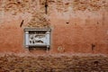 Sculpture of the Lion of Venice on red wall in Venice, Italy