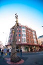 The sculpture made from a dead tree trunk, created by artist Lin Li in 1999 and named Golden Water Mouth at Sydney China town.