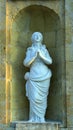 The sculpture maiden praying.
