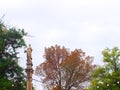 Sculpture of a majestic woman on a column.