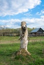 Sculpture of man carved from a tree trunk. Royalty Free Stock Photo