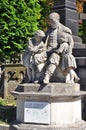 Sculpture of a man and children, cemetery