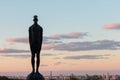 Sculpture of a man with a drop on his head over the cities of Kiev Royalty Free Stock Photo