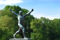 Sculpture of a man with his hands up