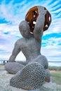 Sculpture of the man holding a ball on the Gold Coast during the Swell Sculpture Festival