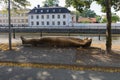 Sculpture of a man lying on the ground. Uppsala. Sweden 08.2019 Royalty Free Stock Photo