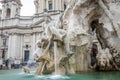 Sculpture marble statue of a lion and a man on the fountain of the four rivers in Piazza Navona in Rome, capital of Italy, as well