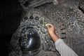 Sculpture with micro carved hallow skull at Hoysaleswara Temple