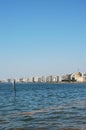 Sculpture Moon on the Shore by Pavlos Vasiliadis and waterfront of Thessaloniki with White Tower and part of Royal theatre