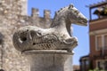 Sculpture of mythological pony, one the figure in the fountain in the cathedral square Duomo di Taormina, Sicily, Italy