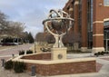 Sculpture on a pedestal outside the Heider College of Business on the campus of Creighton University.