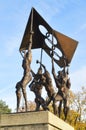 The sculpture of the people carrying the Olympic flag
