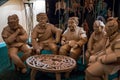 Sculpture of people sitting around a table made from cardboard at Artprize 9