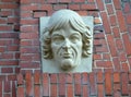 Sculpture portrait of Nikolai Copernicus on the brick facade of the building. Kaliningrad