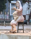 Sculpture of Portuguese fisher women in a roundabout in Portimao at the Algarve coast of Portugal