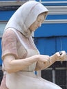 Sculpture of Portuguese fisher women in a roundabout in Portimao at the Algarve coast of Portugal