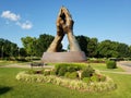 Sculpture Praying hands on the entrance of university