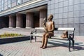 Sculpture of Pushkin sitting on the bench