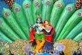 Sculpture of Radha Krishna and peacock feather during Dahi Handi festival