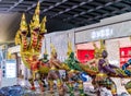 Sculpture of Ramayana traditional Angel captured Thai serpent or Naga in Suvarnabhumi International Airport Bangkok, Thailand