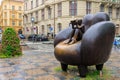 The sculpture Reader in an armchair is made in bronze. Tourist attractions. August 24, 2022 Prague Czech Republic