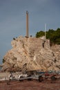 Sculpture on a rocky cliff at the shore in Petrovac