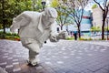 Sculpture of a running man in a small park. Public art in Montreal, Quebec, Canada Royalty Free Stock Photo