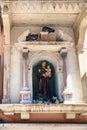Sculpture of a Saint in urban house in Venice