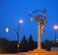Sculpture In Saskatoon Saskatchewan With Streetlights