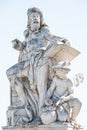 Sculpture of scientist with a book and his scholar on Zoll Bridge in Magdeburg downtown at direct light background, Germany,