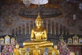 A sculpture of a seated Buddha in the temple of Wat Rakhang Khositaram Ubosot. Bangkok, Thailand