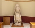 Sculpture of a seated woman inside the Museum of Egyptian Antiquities in Cairo, Egypt.