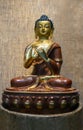 Sculpture Siddhartha Gautama -Sanskrit gold dark red orange coloring