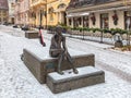 Sculpture Sitting with headphones